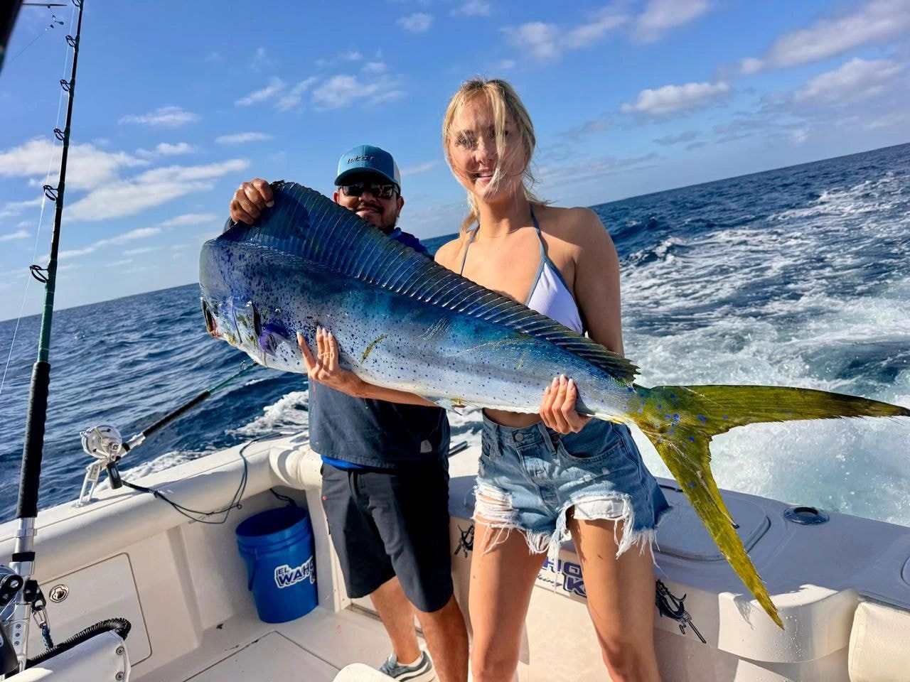Angler holding large dorado